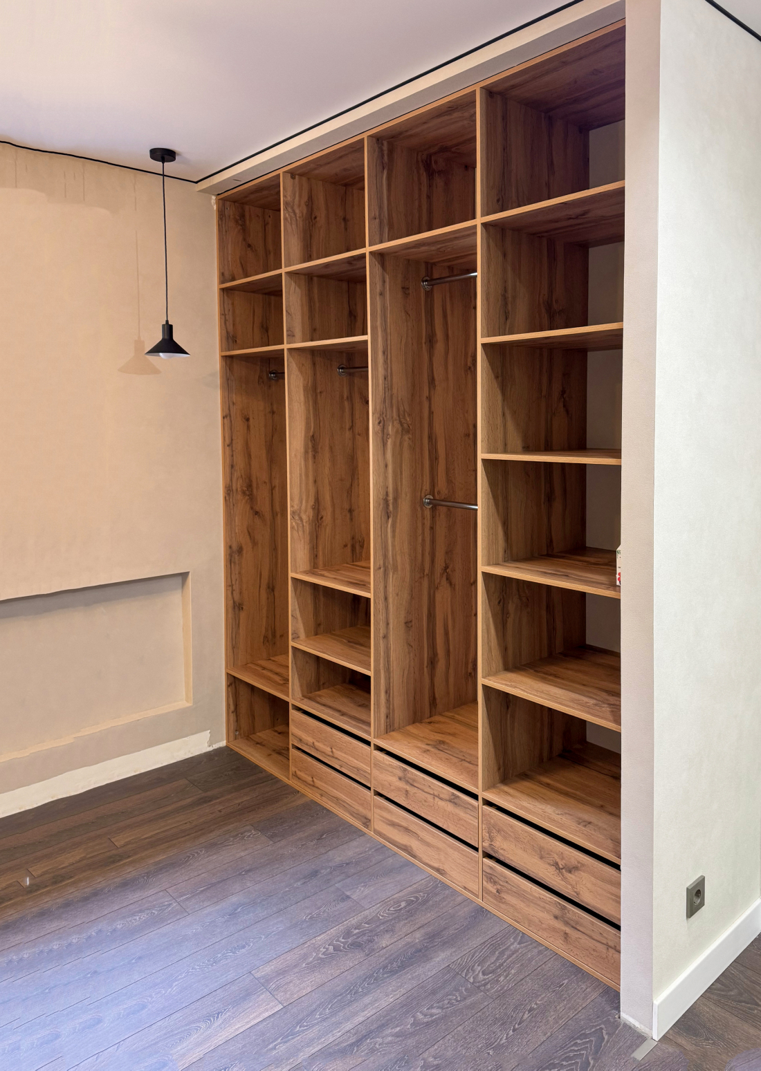 Built-in walnut wardrobe in alcove