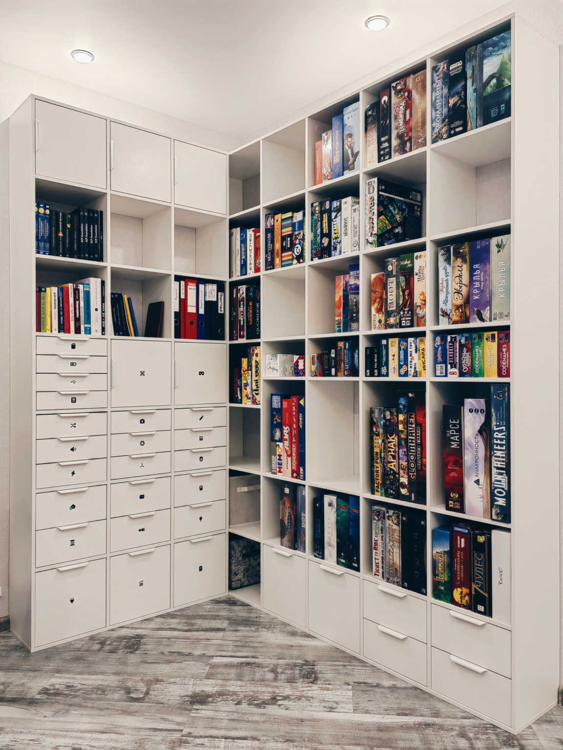 L-shaped corner shelving with board games